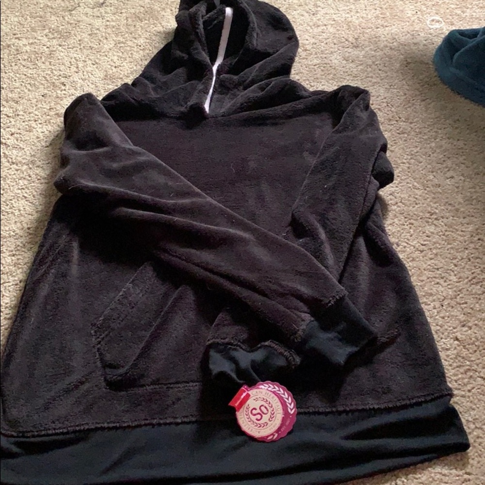 A black and soft pj sweater perfect for a night in